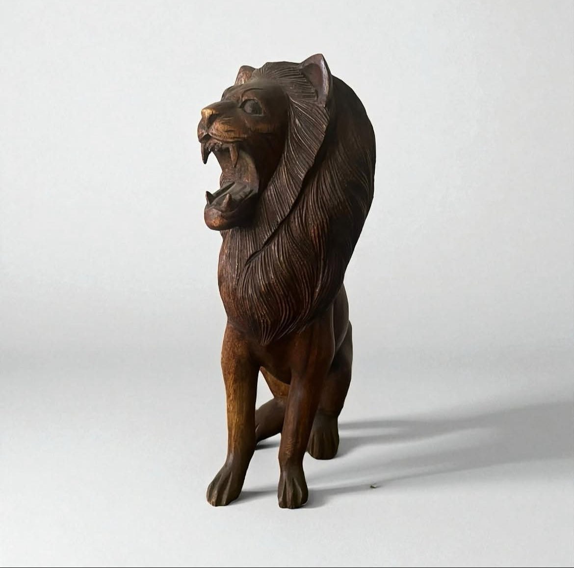Indonesian Wooden Sitting Lion Sculpture