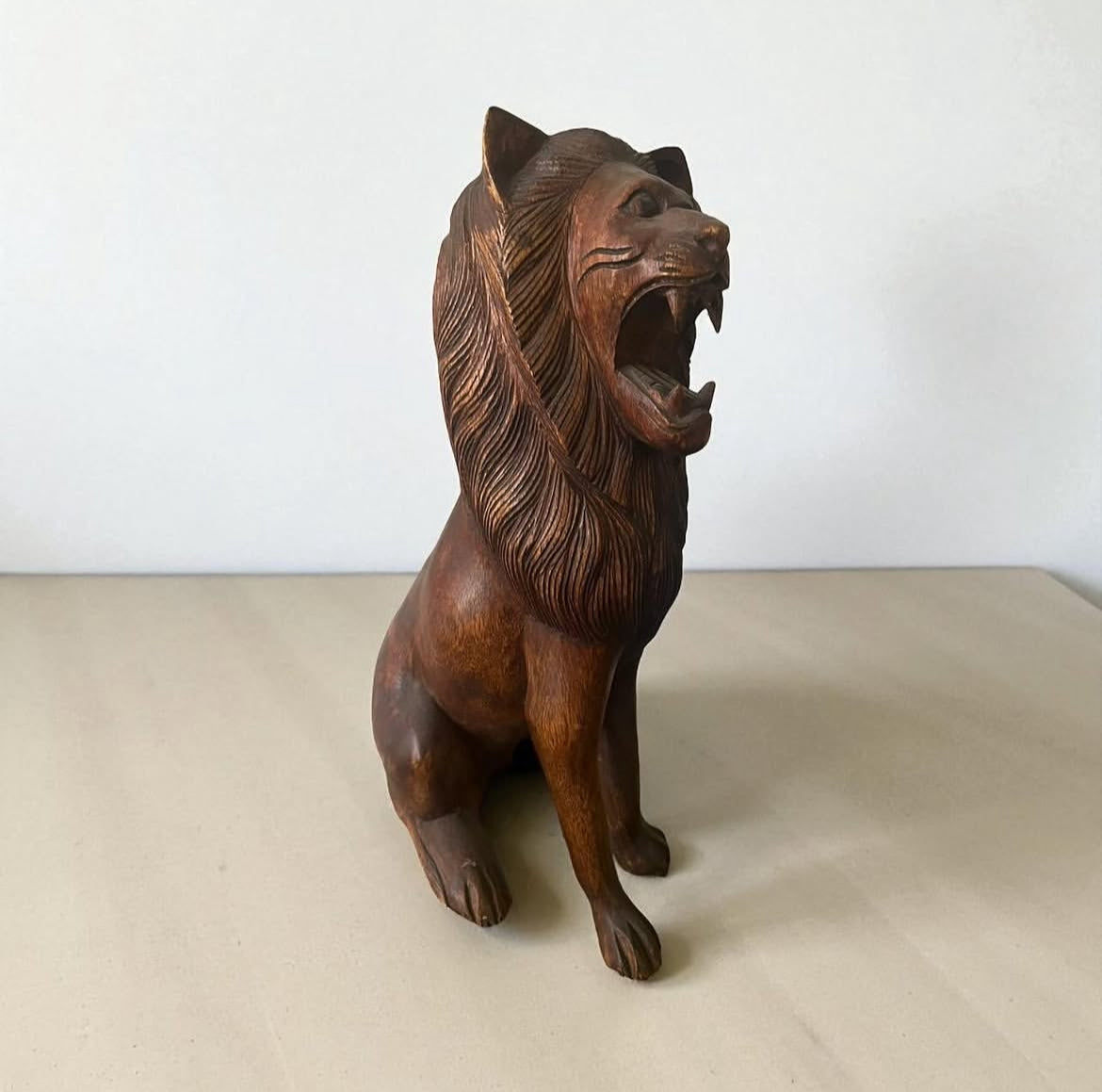 Indonesian Wooden Sitting Lion Sculpture