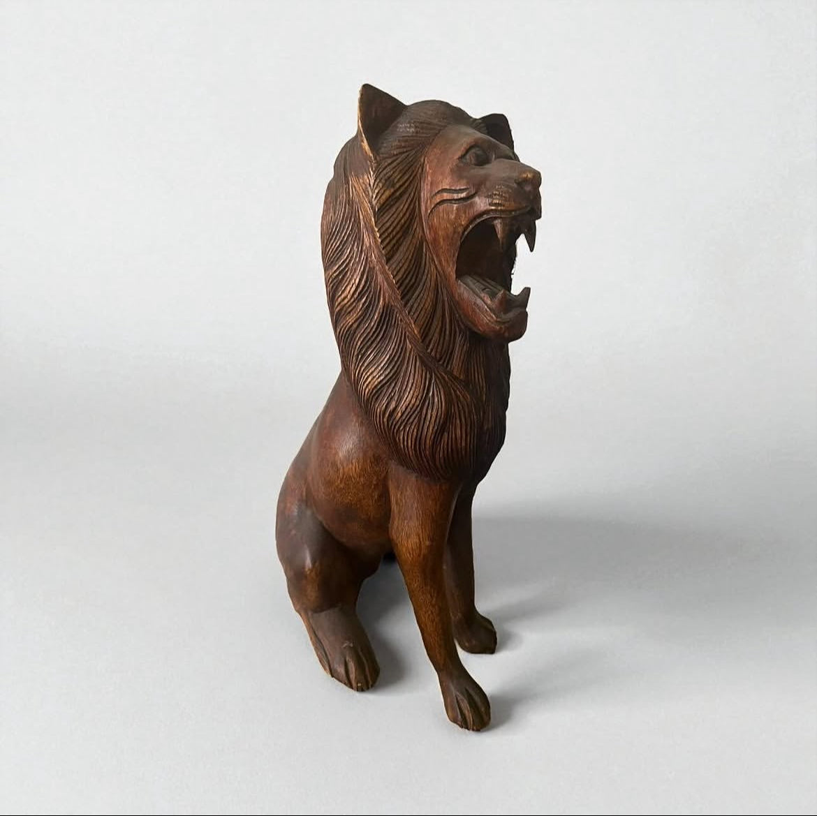 Indonesian Wooden Sitting Lion Sculpture